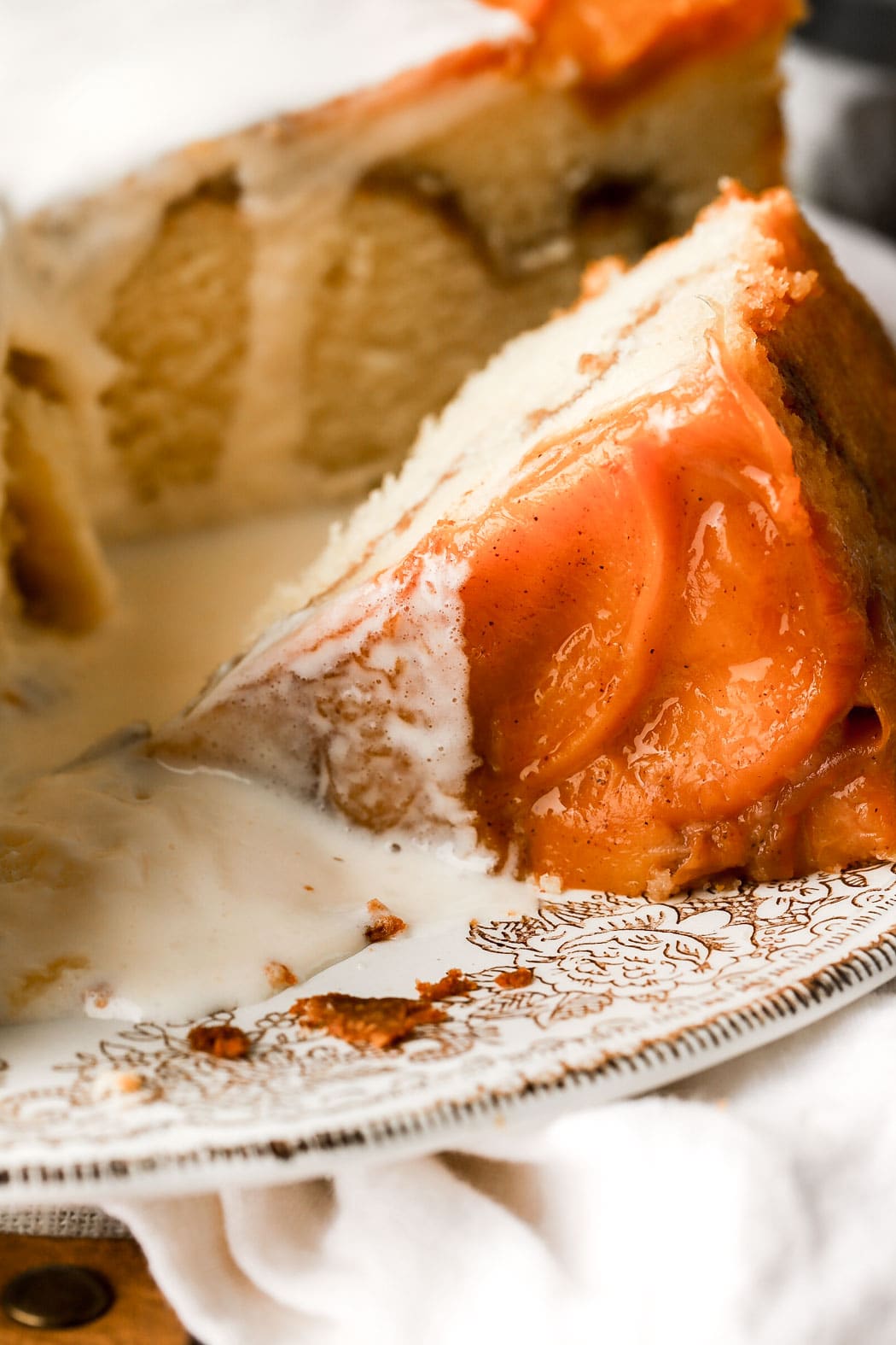 slice of peach cobbler pound cake with vanilla ice cream