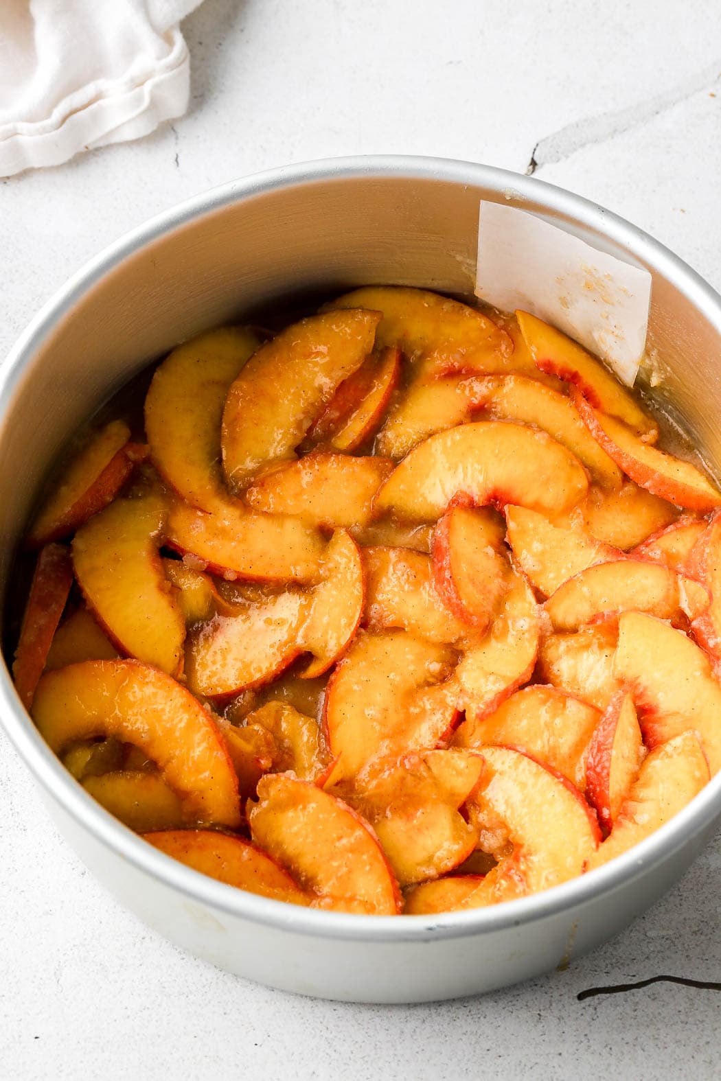 peaches flat on the bottom of a lined pan