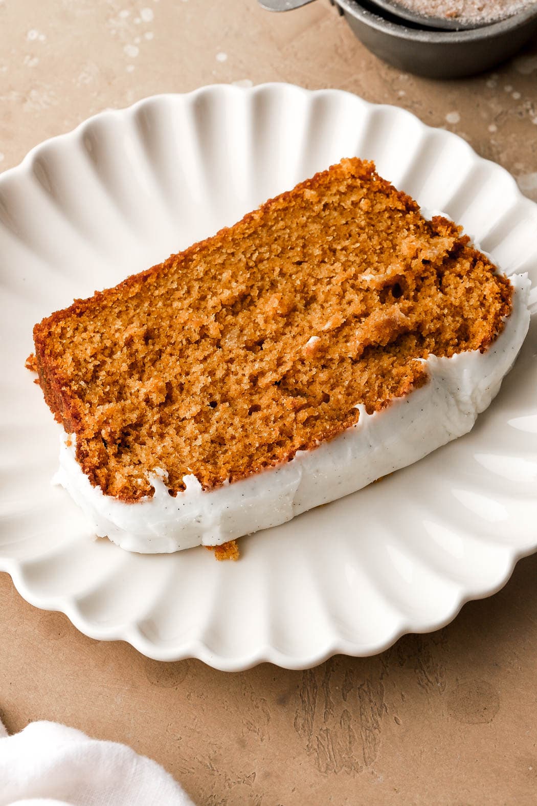 slice of frosted pumpkin bread