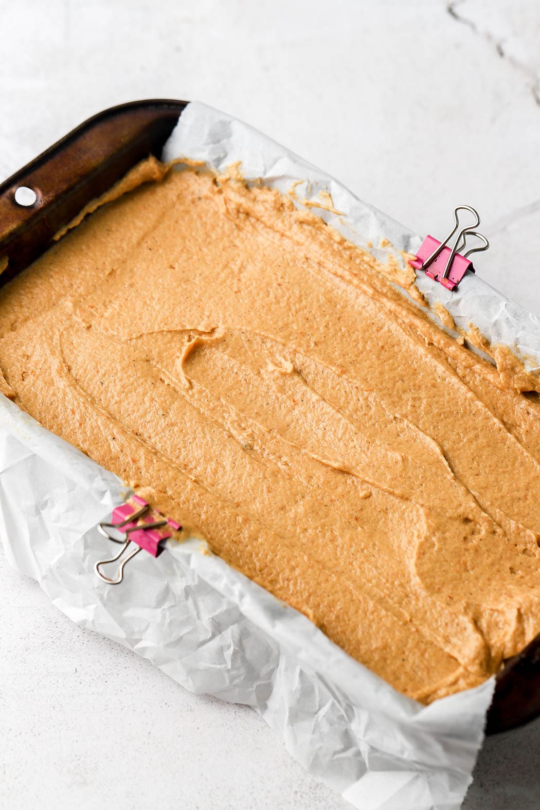 pumpkin bread batter in prepared loaf pan