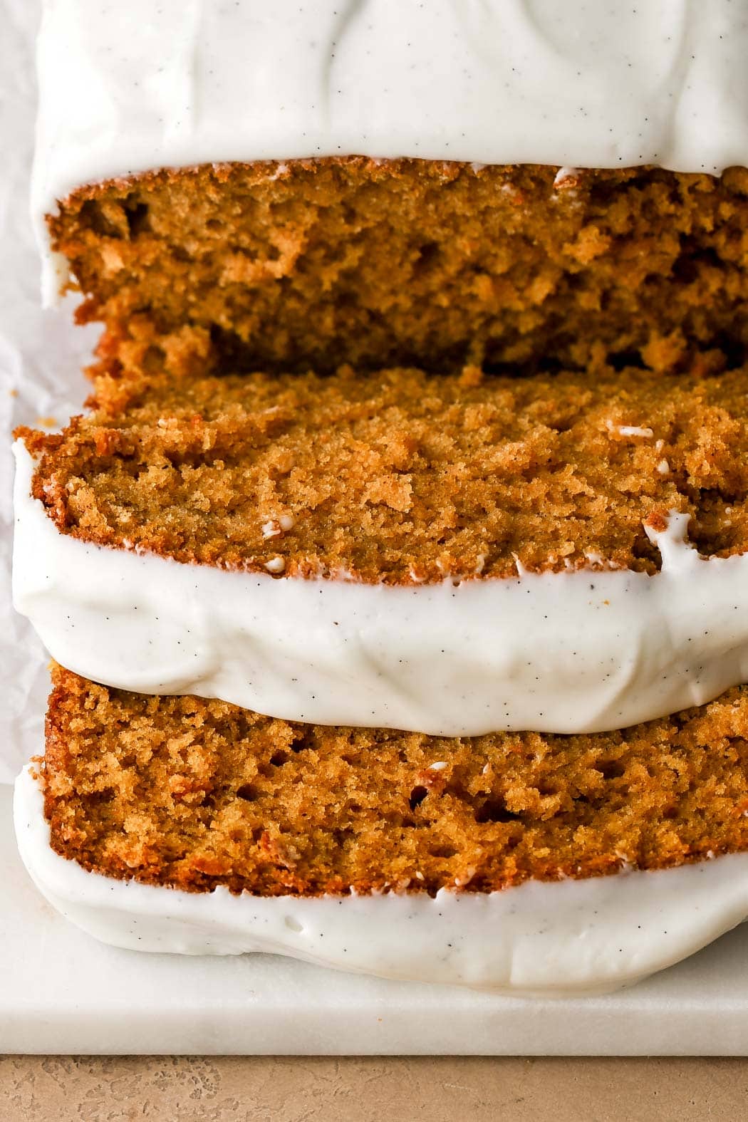 slices of pumpkin bread with cream cheese frosting