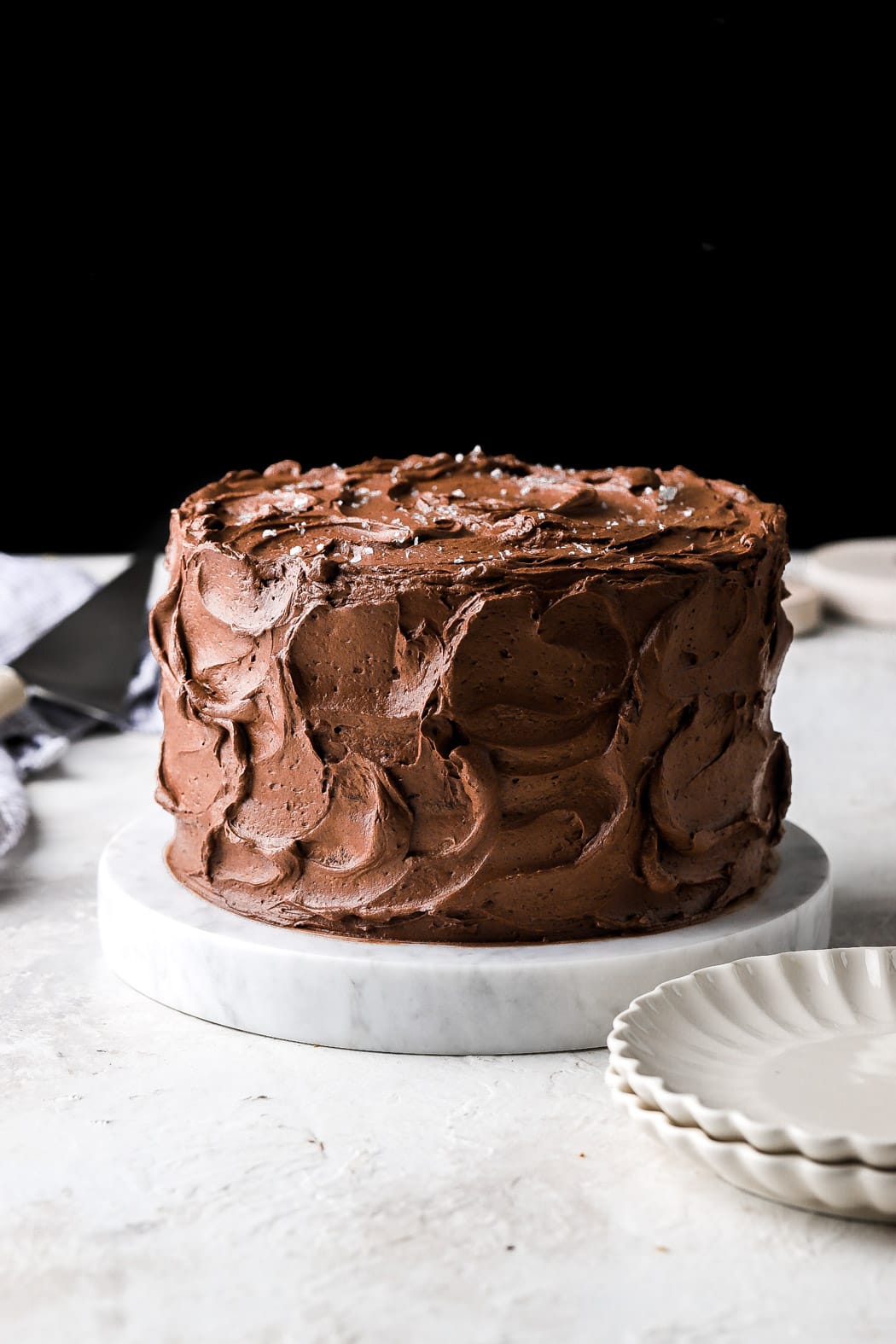8 inch chocolate cake with swirls of frosting