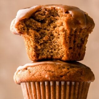 Pumpkin banana muffins stacked with bite taken out