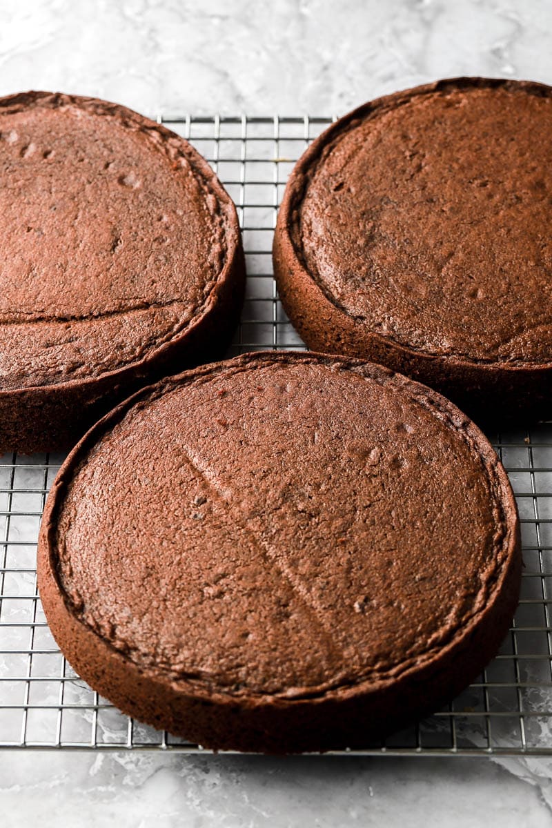 baked chocolate cakes cooling on a rack