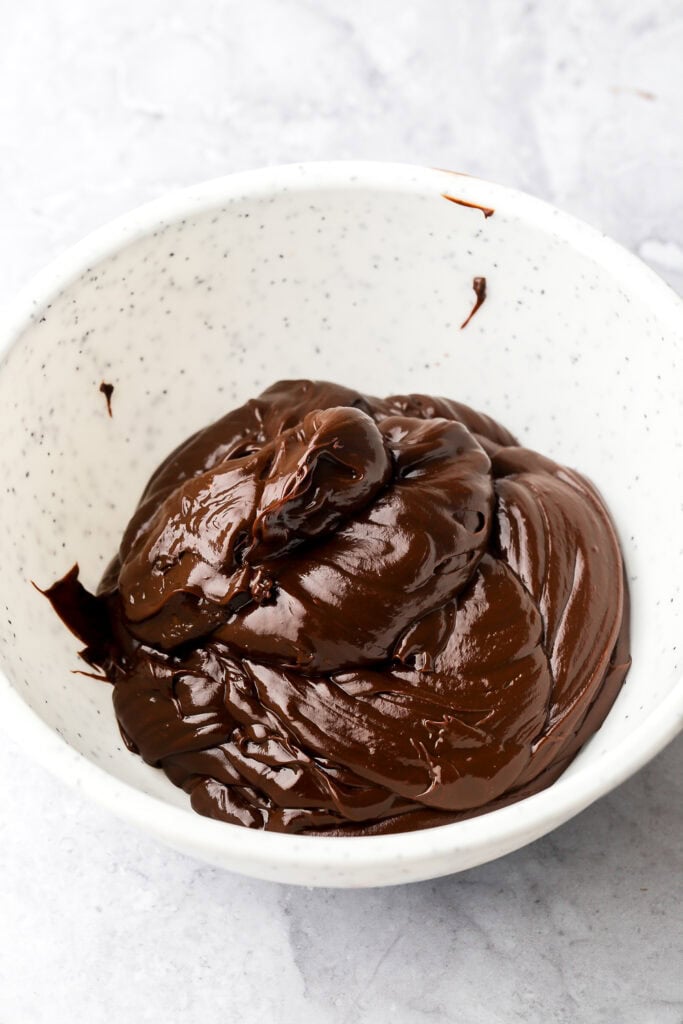 Chocolate ganache cooled and thick in a bowl