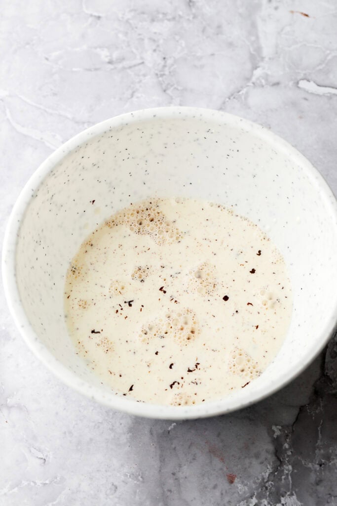 Hot cream on top of chocolate in a bowl