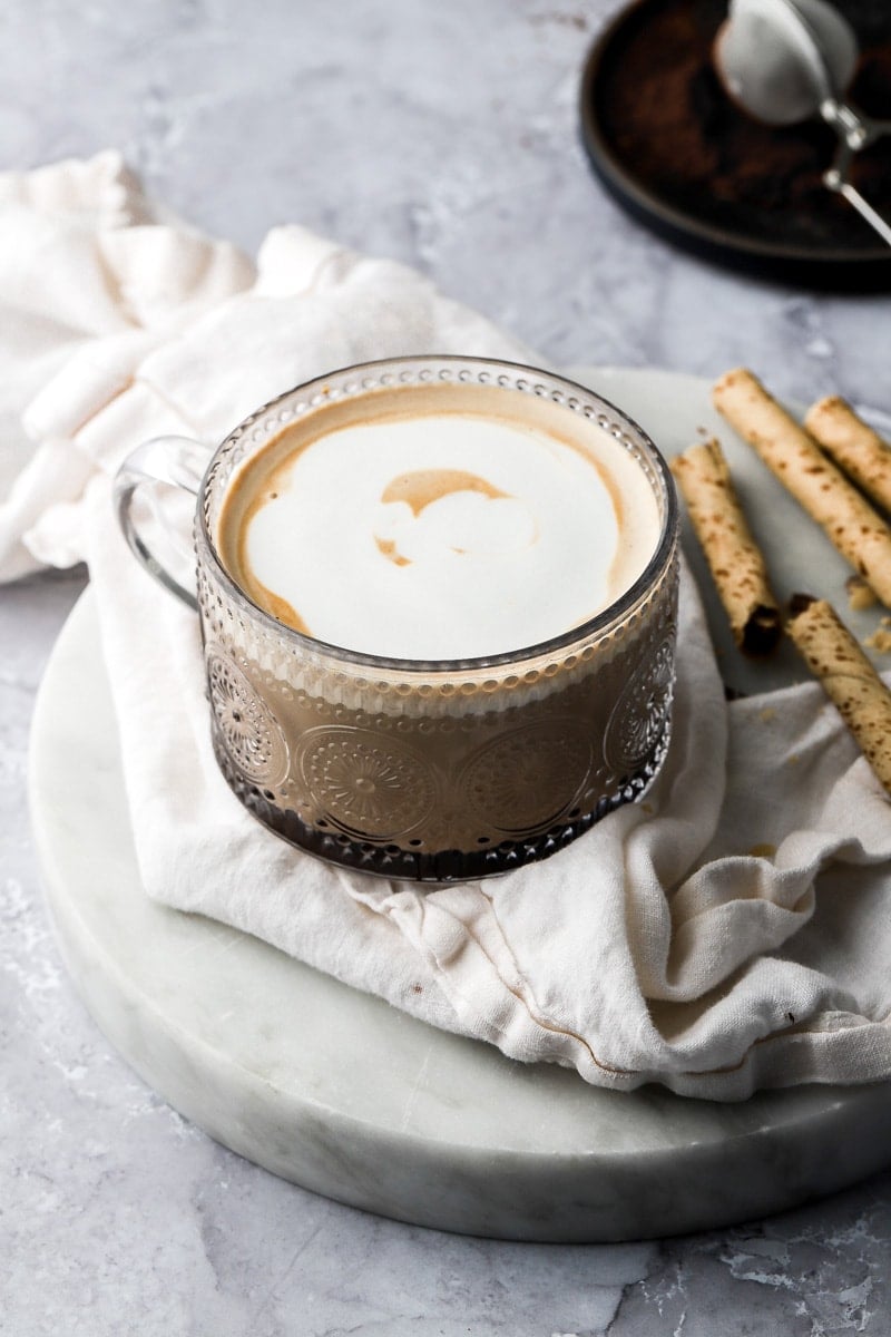cup filled with espresso and frothed milk