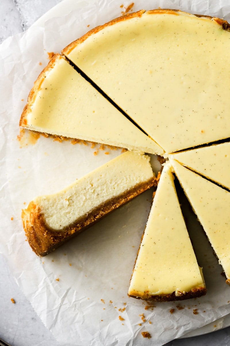 round cheesecake with one slice on the side