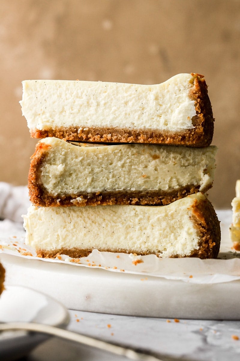 three layers of vanilla cheesecake stacked