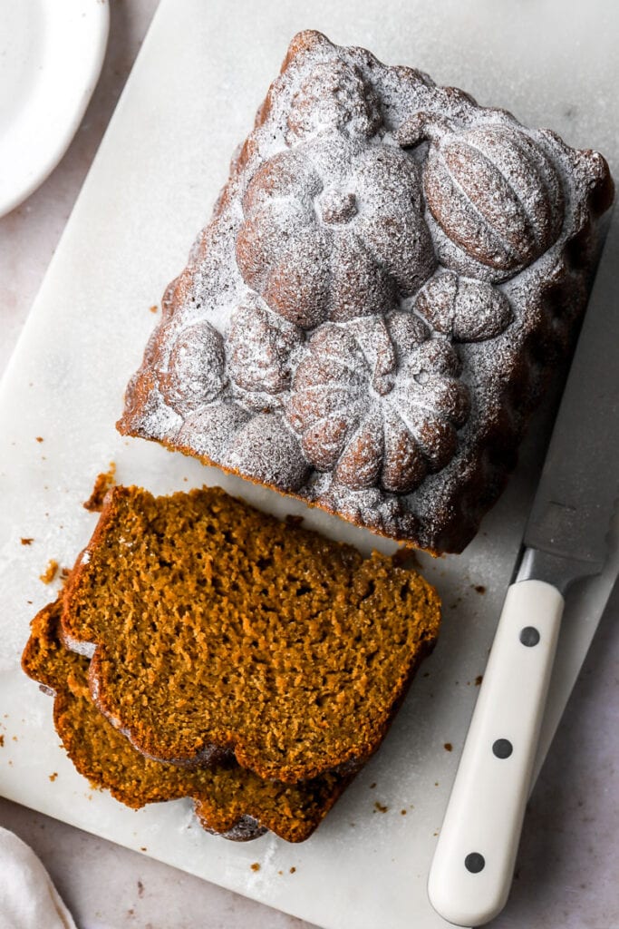 slice of pumpkin banana bread dusted with powdered sugar