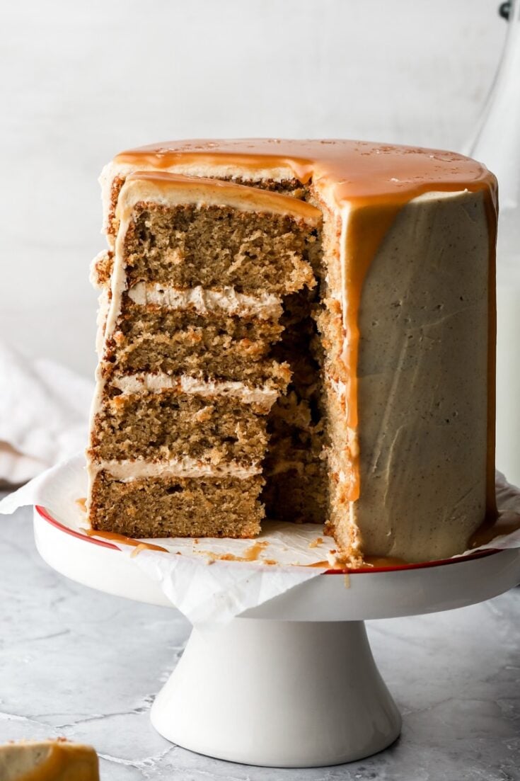 maple spice cake frosted with maple buttercream and topped with salted caramel sauce