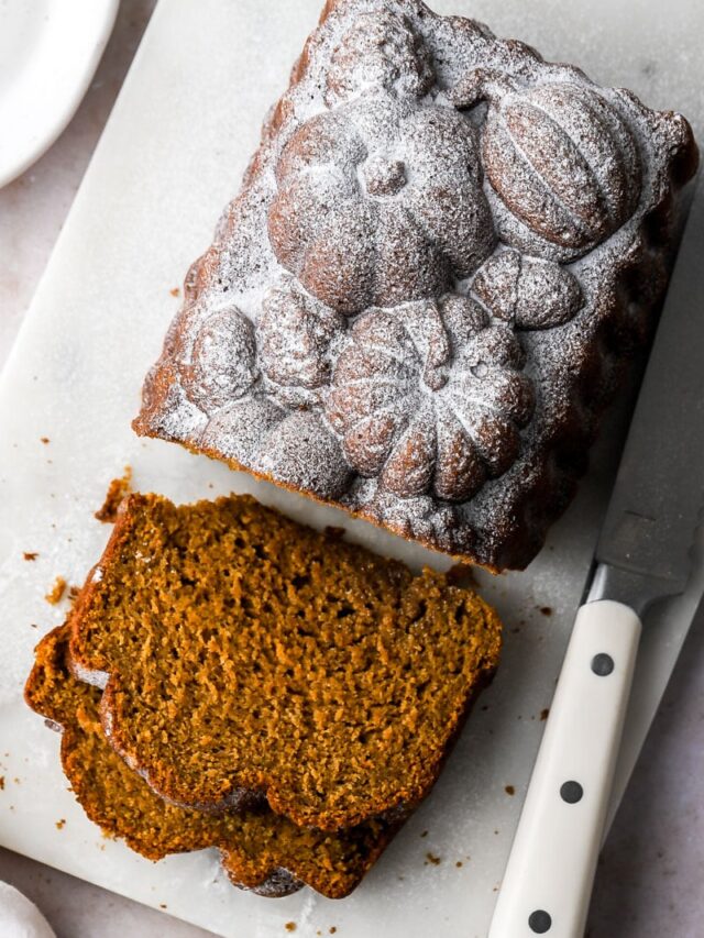 slice of pumpkin banana bread dusted with powdered sugar