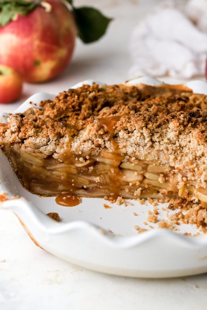 drizzle of caramel on apple pie sliced open