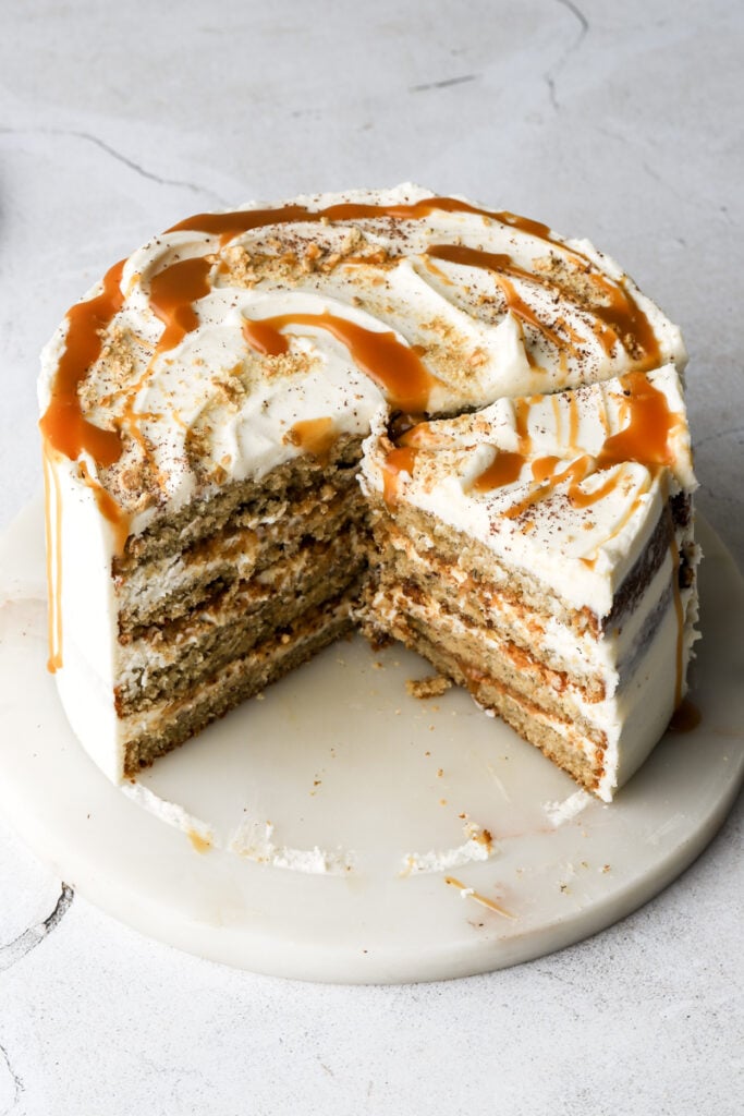 banoffee cake on marble board with slices cut