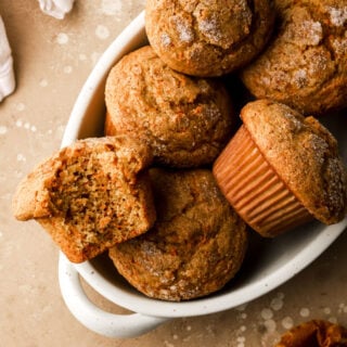 carrot cake muffins in a bowl with a bite taken out