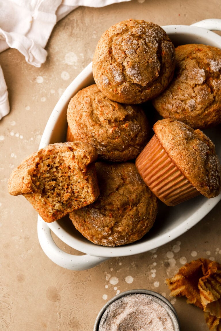 carrot cake muffins in a bowl with a bite taken out