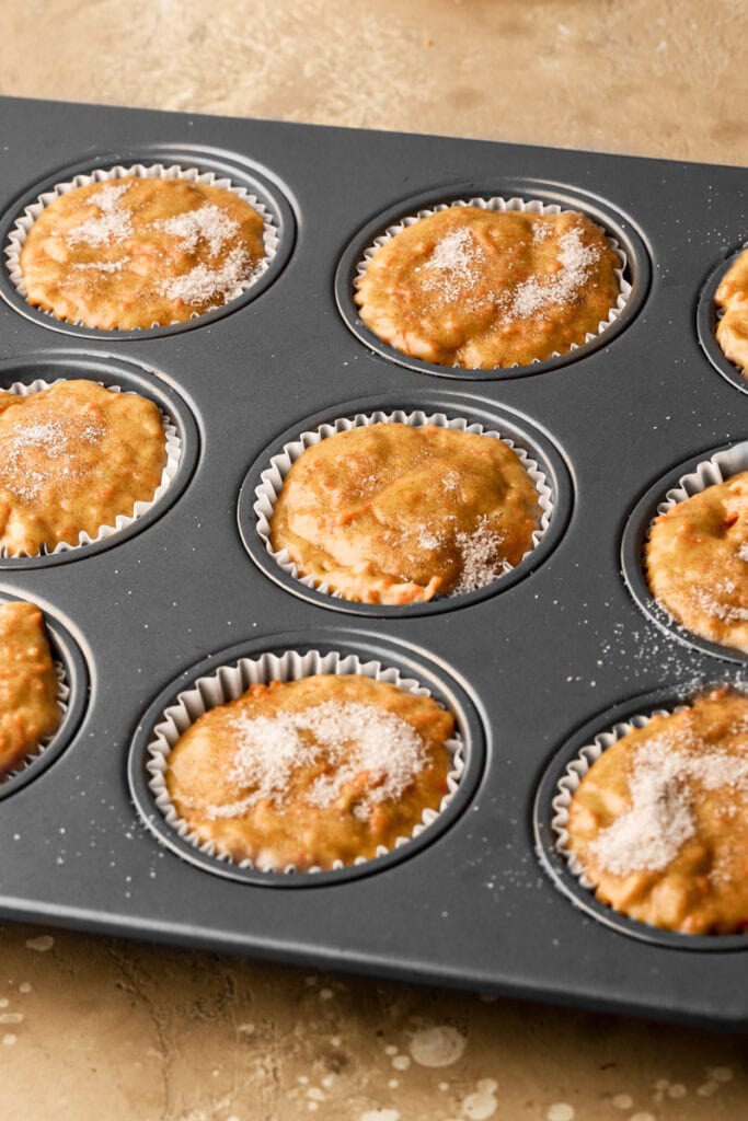 muffins in pan, sprinkled with sugar