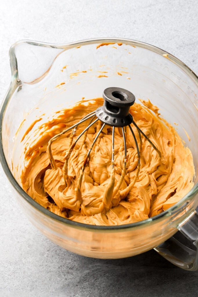 cream cheese and dulce de leche filling in a bowl with a whisk attachment