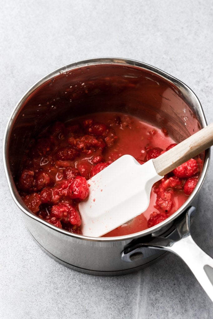 ingredients for raspberry filling mixed in a pot