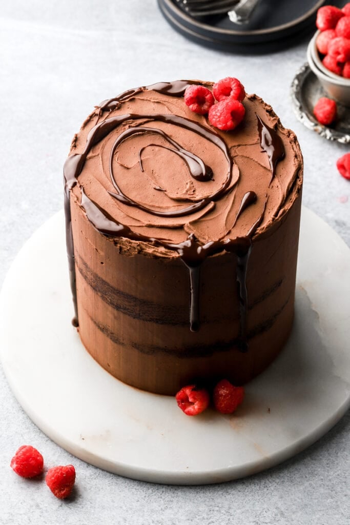 chocolate raspberry cake with chocolate ganache drip and fresh raspberries