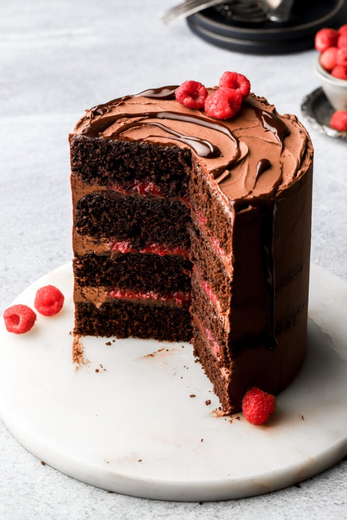 chocolate raspberry cake with chocolate drip and fresh raspberries