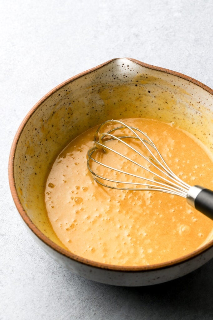 melted butter whisked with sugar and egg