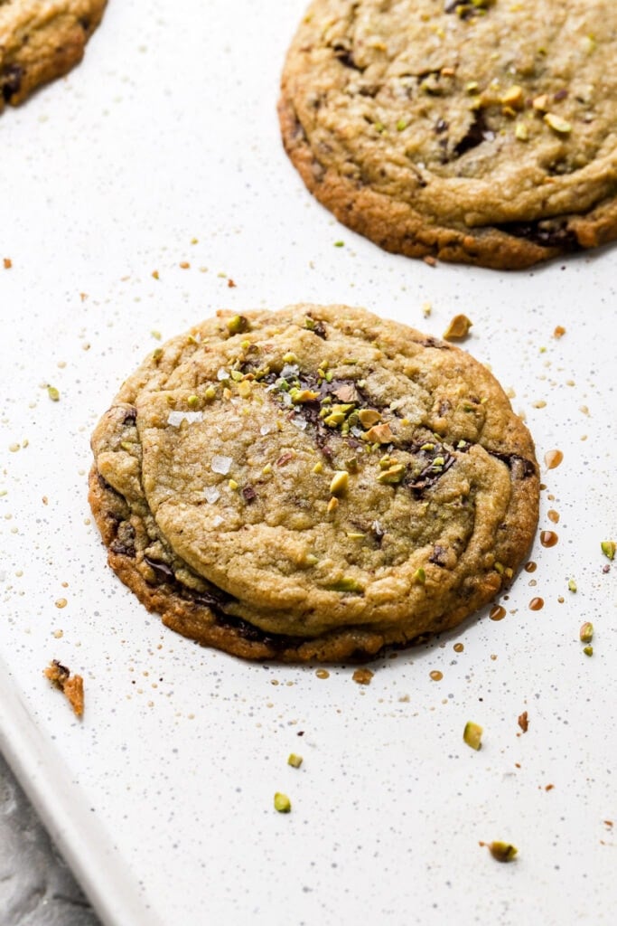 pistachio chocolate chip cookie on a cookie sheet