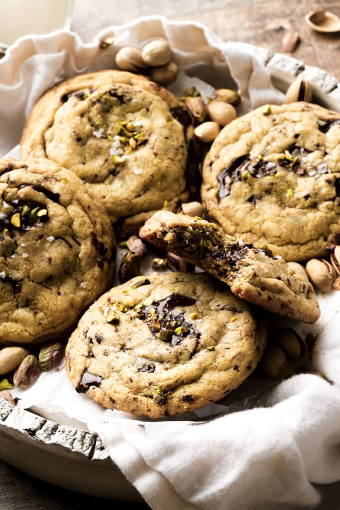 cookies in a bowl and bite taken out of a cookie