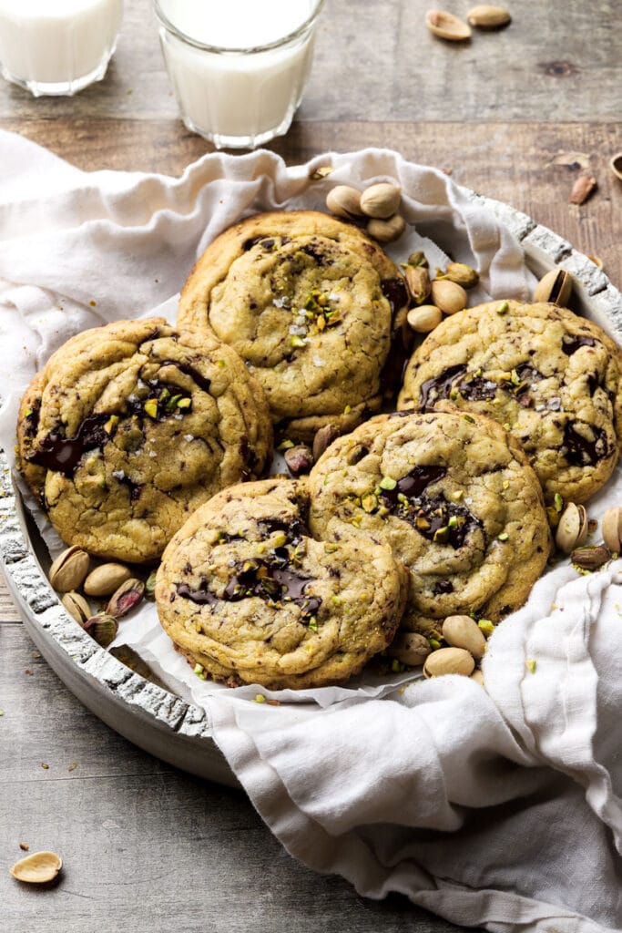 bowl of cookies with 2 cups of milk