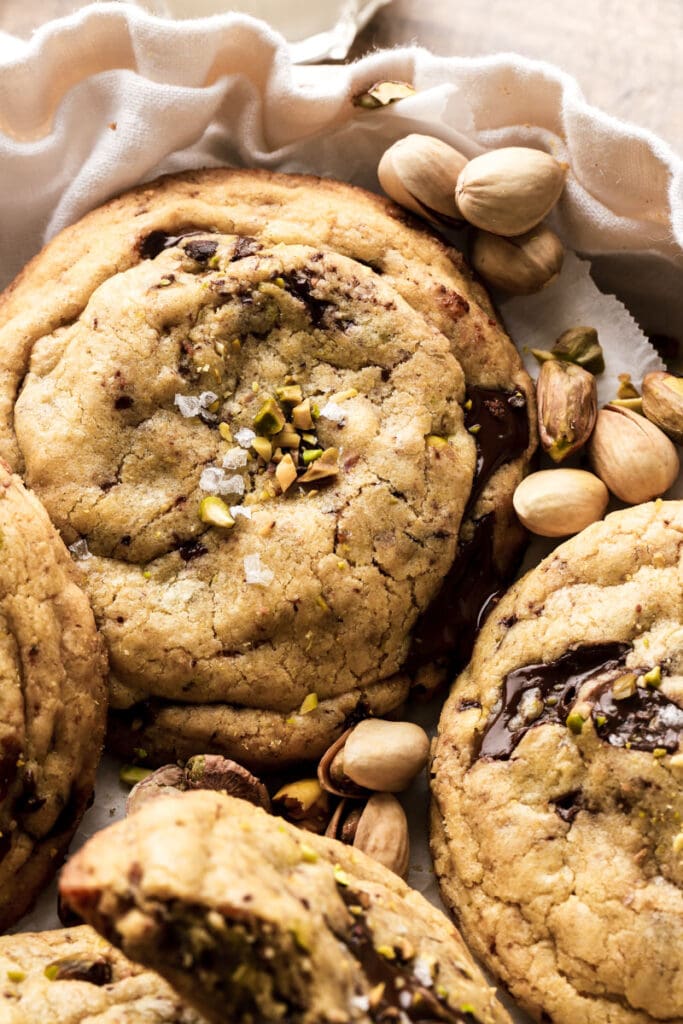 chocolate chip pistachio cookies in a bowl with pistachios