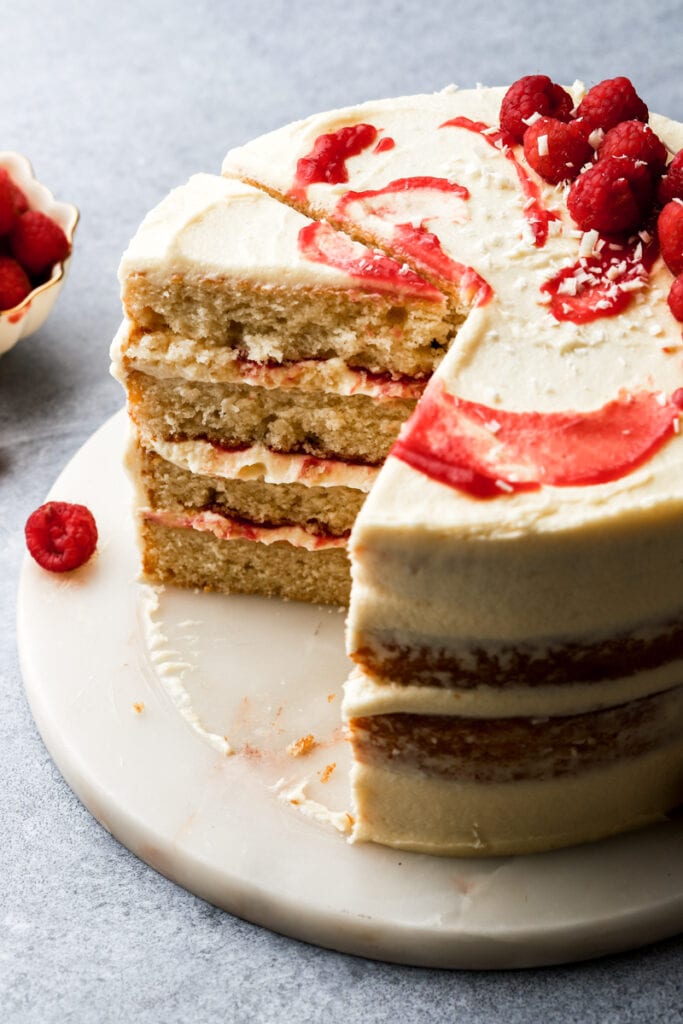 sliced white chocolate raspberry cake