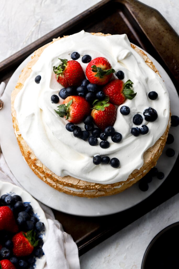overhead view of chantilly cake with fresh berries