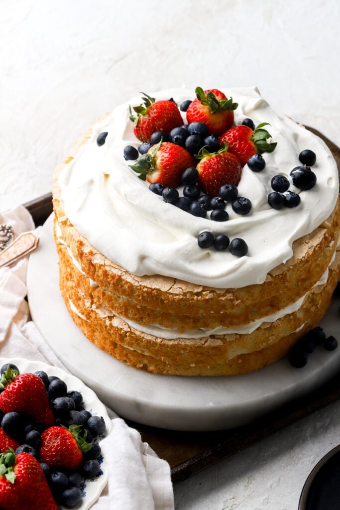 chantilly cake topped with fresh berries