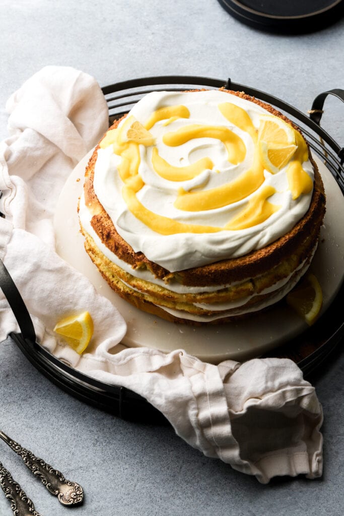 cake topped with whipped cream and lemon curd