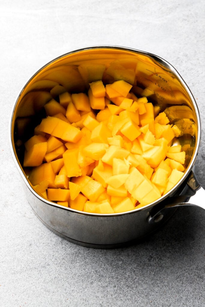 sliced mangos in the pot
