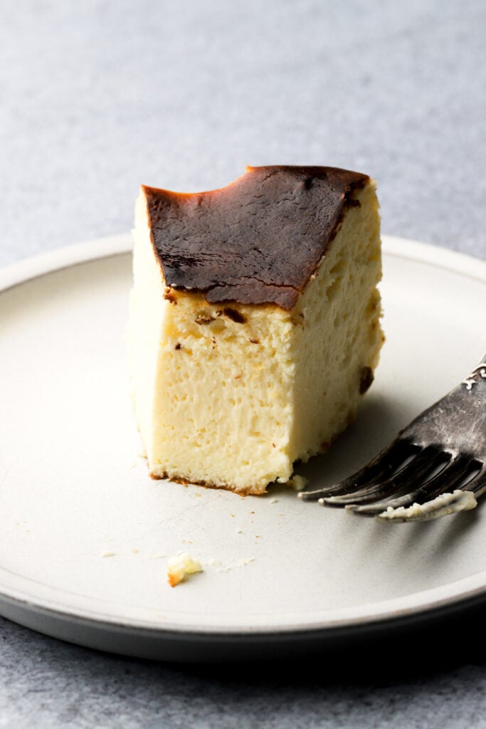 slice of cheesecake on a plate with a fork