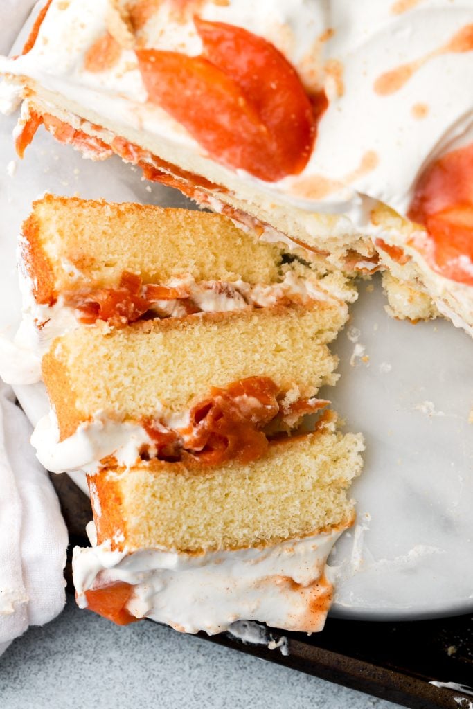 peaches and cream cake slice laying on it's side
