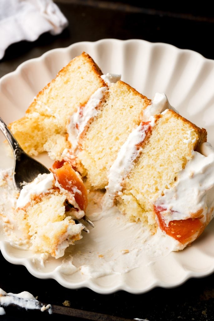 slice of peaches and cream cake on a plate