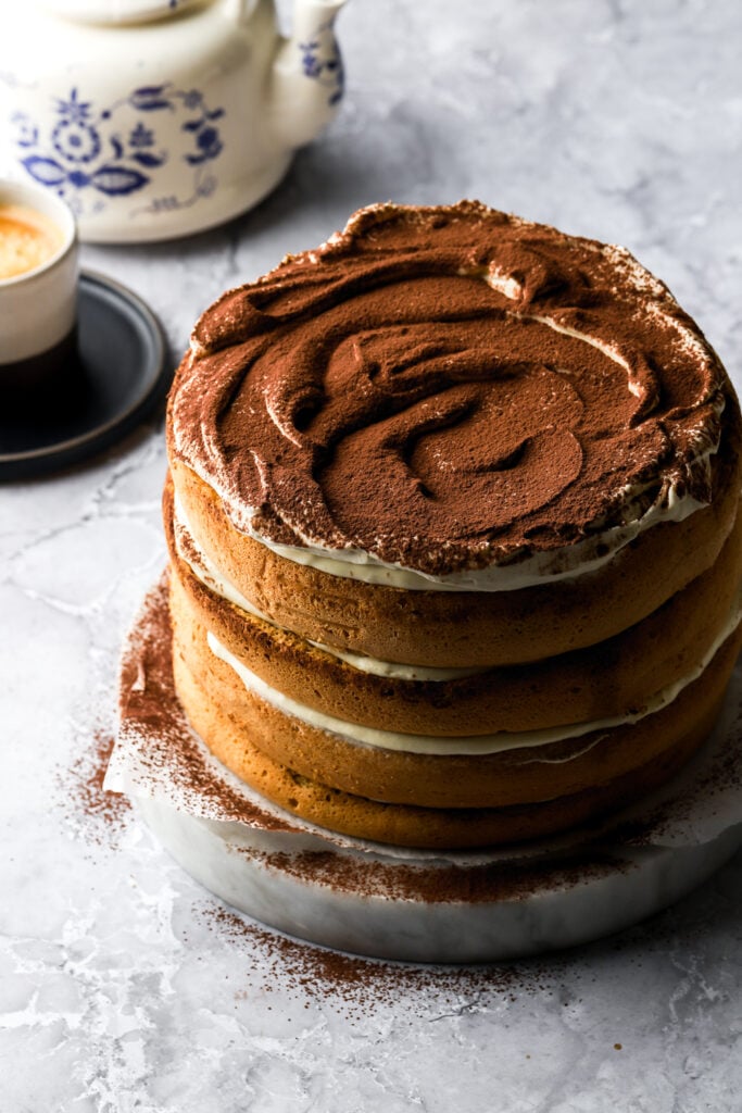 tiramisu cake with coffee and tea pot 