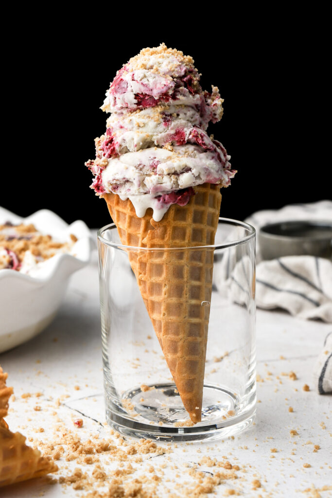 mixed berry streusel ice cream in a cone