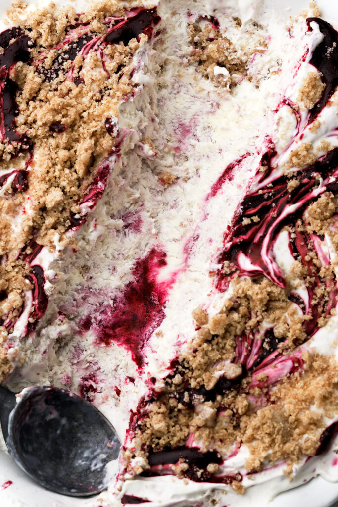 berry streusel ice cream close up with a scoop of ice cream removed