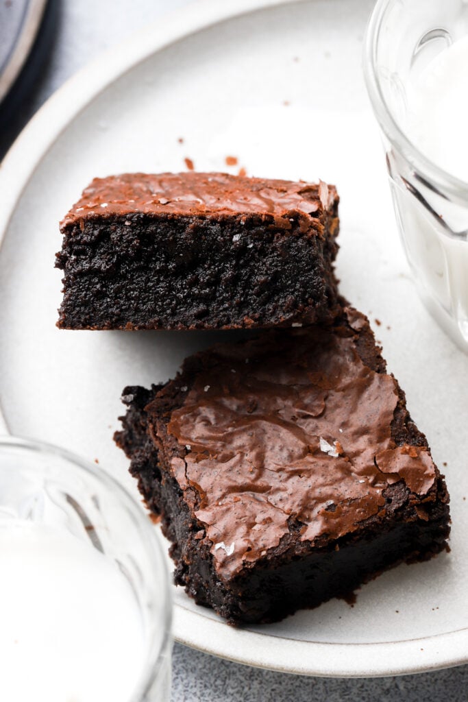 two brown butter brownies on a plate