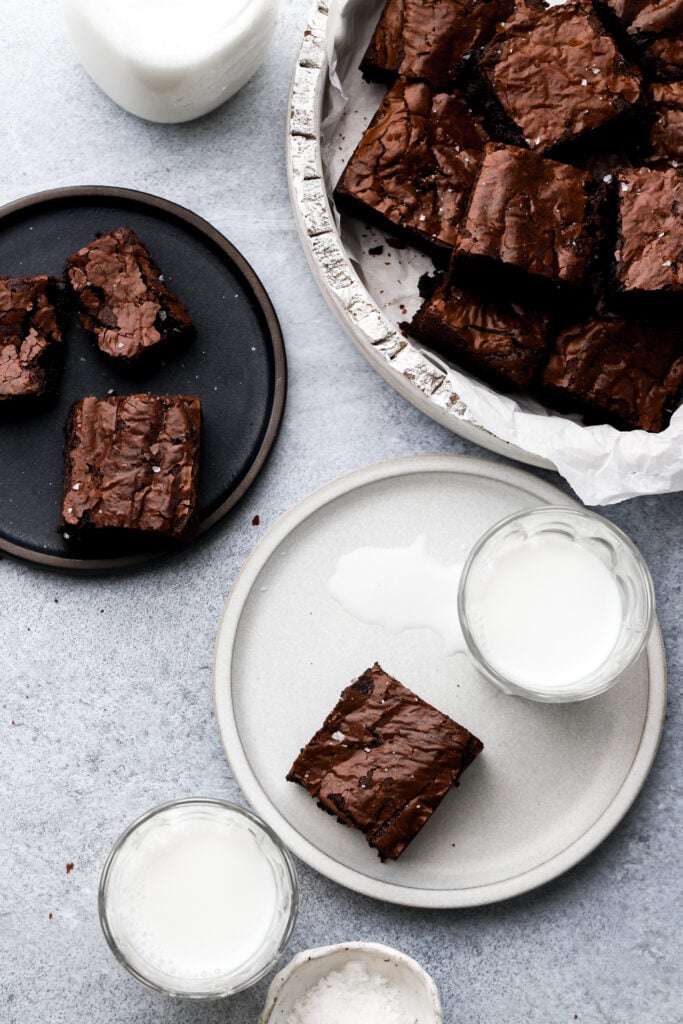 brown butter brownies on a plate with milk