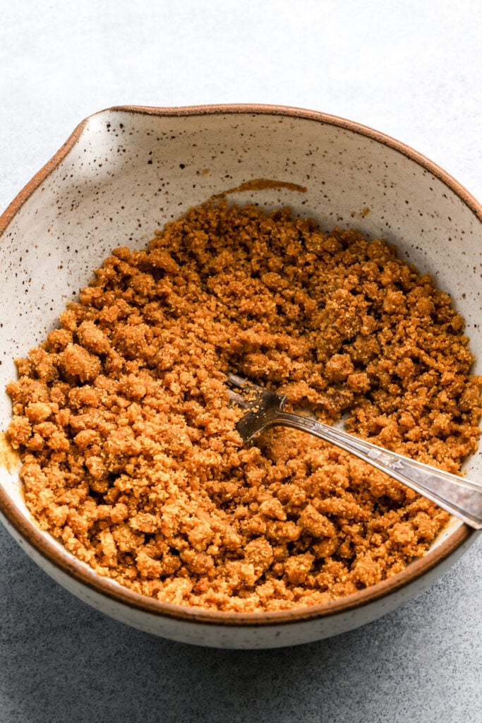 sugar, flour, graham cracker crumbs mixed together in a bowl