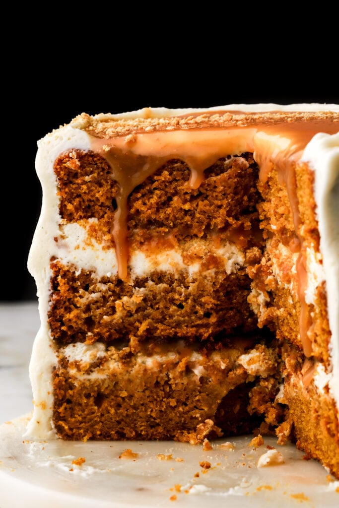 close up of pumpkin cake with caramel dripping down