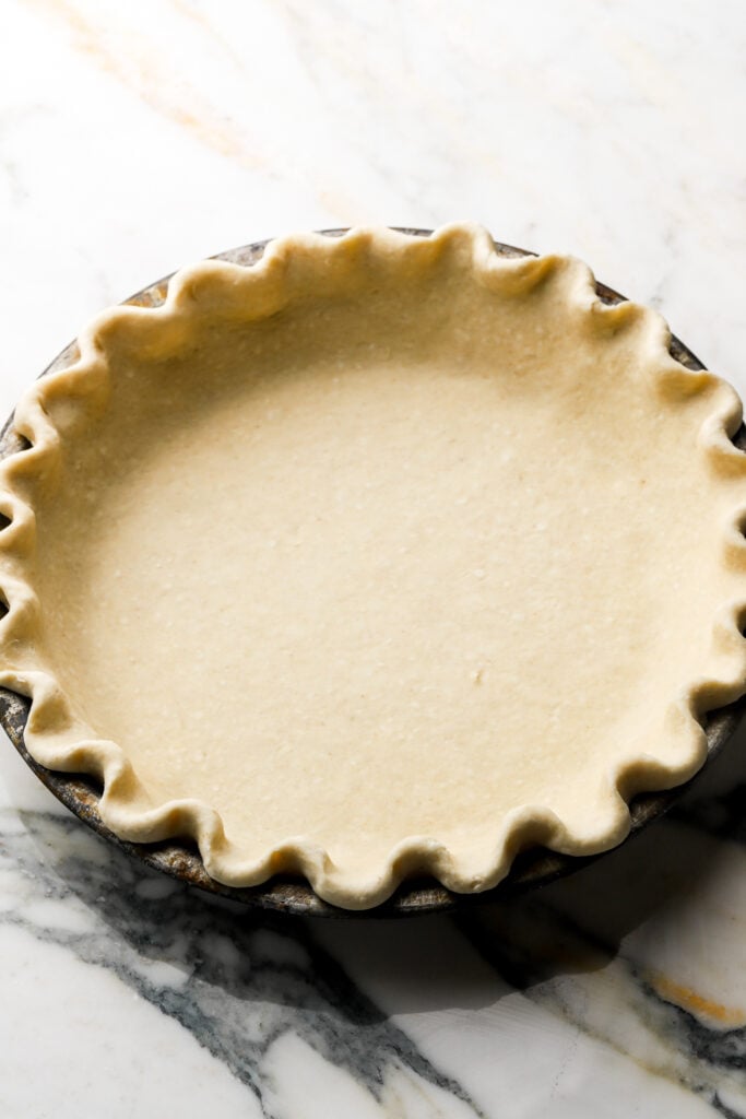 raw pie crust in prepared pan