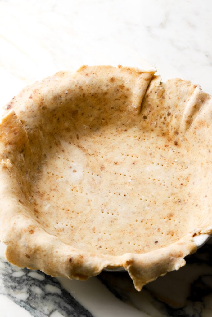 brown butter pie crust docked on the bottom