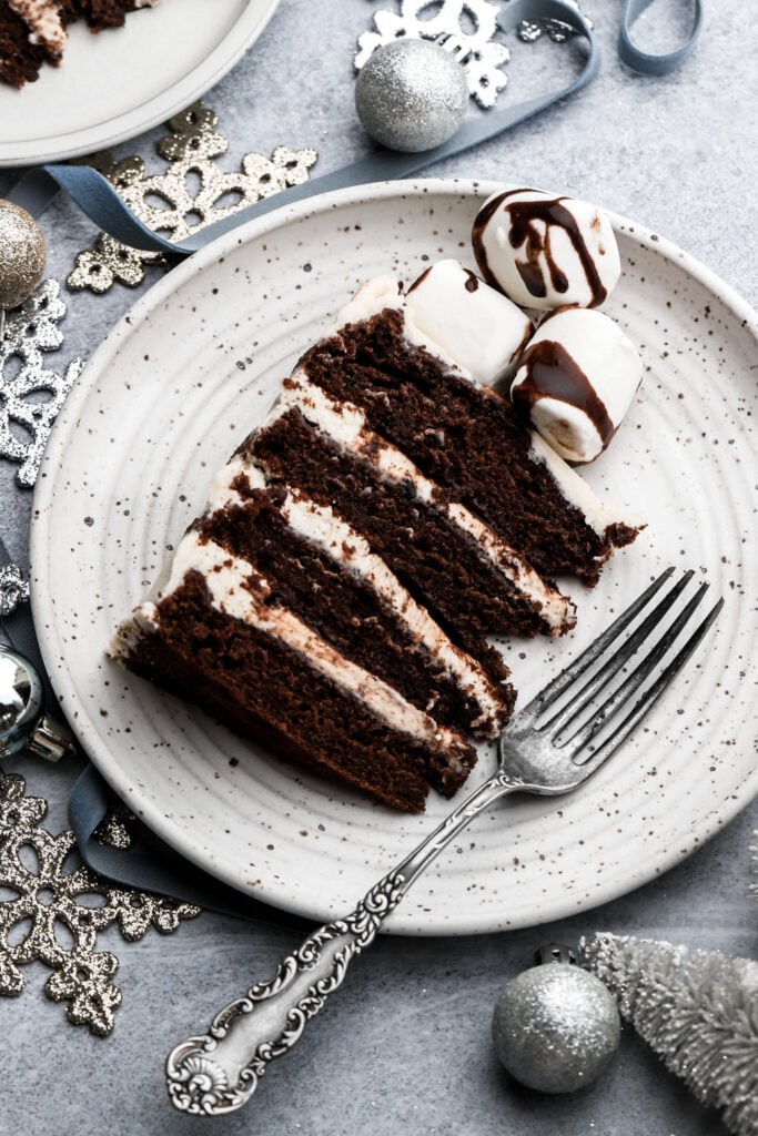 slice of hot chocolate cake on a plate with a fork