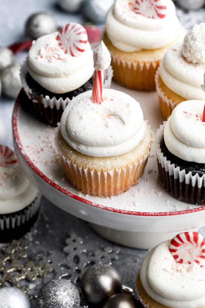 white chocolate peppermint cupcakes on a small cake platter