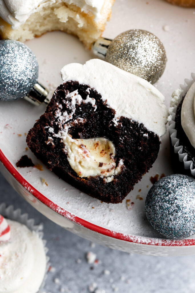 chocolate peppermint cupcake cut in half with white chocolate peppermint truffle inside